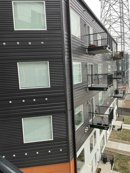Side of apartment building with patios